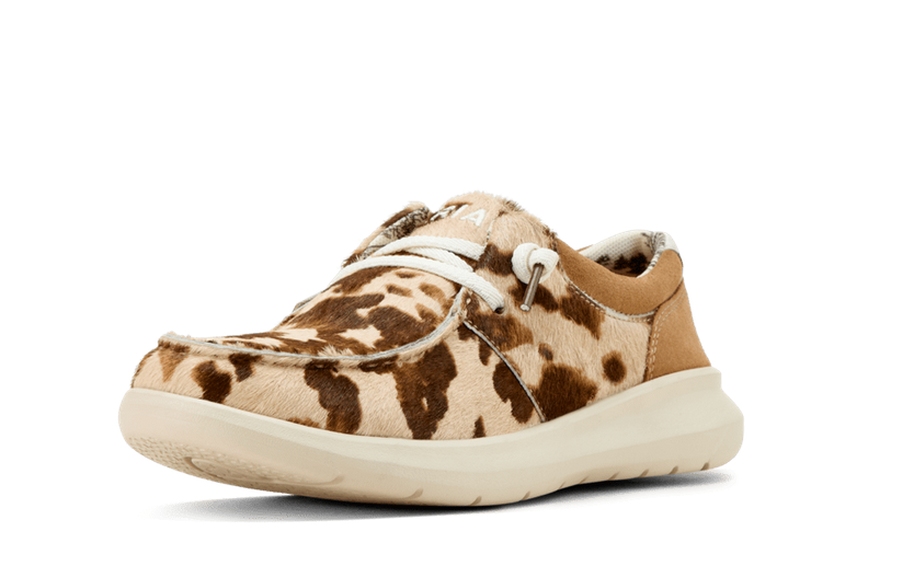 Brown and beige sneaker with a cow print pattern on a white background